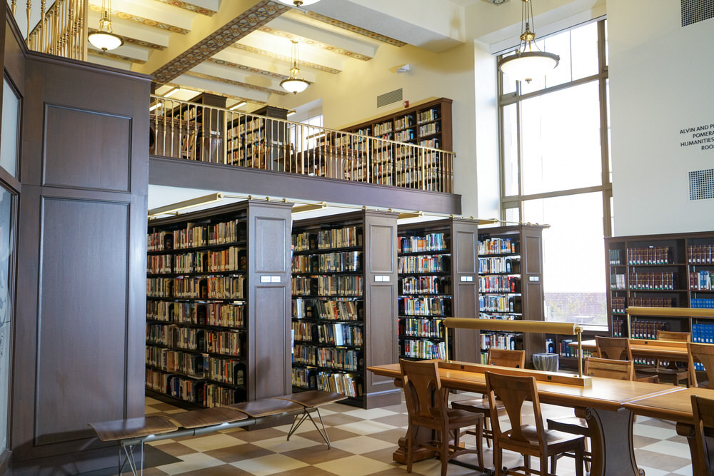 Central Library tables and bookshelves by a window