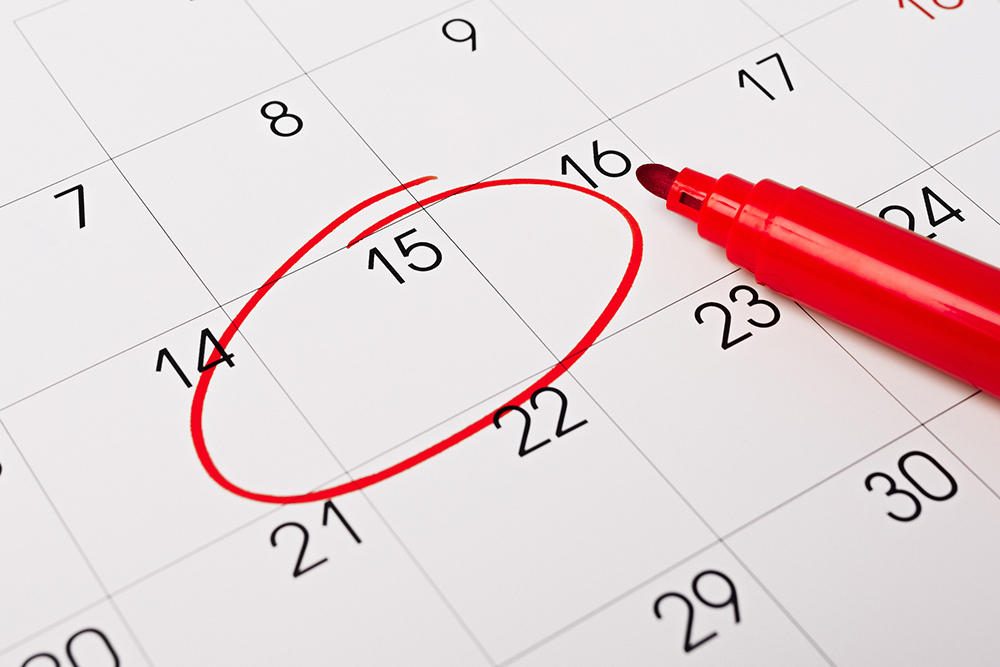 calendar numbers closeup with a red marker and circled date
